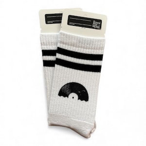 May include: Pair of white socks with black stripes and a vinyl record graphic. The socks have the text "ilove mixtapes" on the tag and are size 37-41.