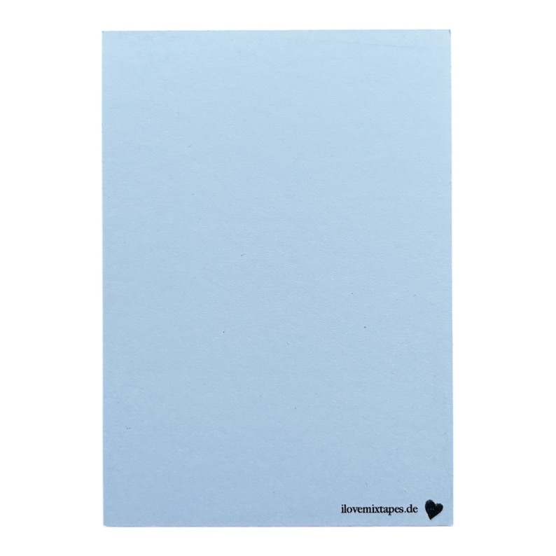 May include: A rectangular light blue card with a smooth, matte finish. In the bottom right corner, the text "ilovemixtapes.de" is printed in a small, black, sans-serif font, followed by a small, solid black heart icon.