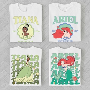 four white t-shirts with the characters Tiana and Ariel from Disney's animated films. The t-shirts feature the characters in various poses and designs, with the text "EST. 2009" and "BEST DAY EVER" printed on them.