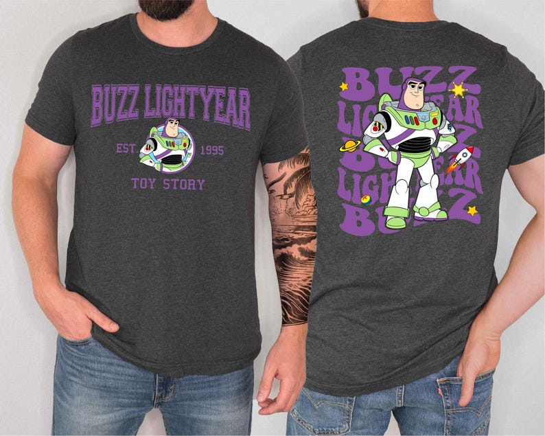 a man wearing a gray t-shirt with a design of Buzz Lightyear from the Toy Story franchise.