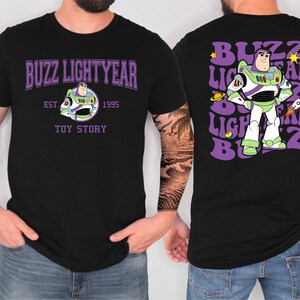 A man wearing a black t-shirt with a graphic of Buzz Lightyear from the Toy Story franchise.