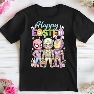 A black t-shirt with a colorful graphic design featuring three cartoon characters - Spider-Man, Captain America, and Iron Man - along with Easter eggs and flowers.