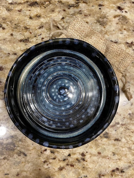 Handcrafted ceramic cup and small dish