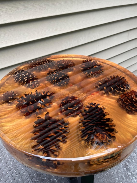 Gorgeous handmade side table, pinecones, bronze base, black metal legs