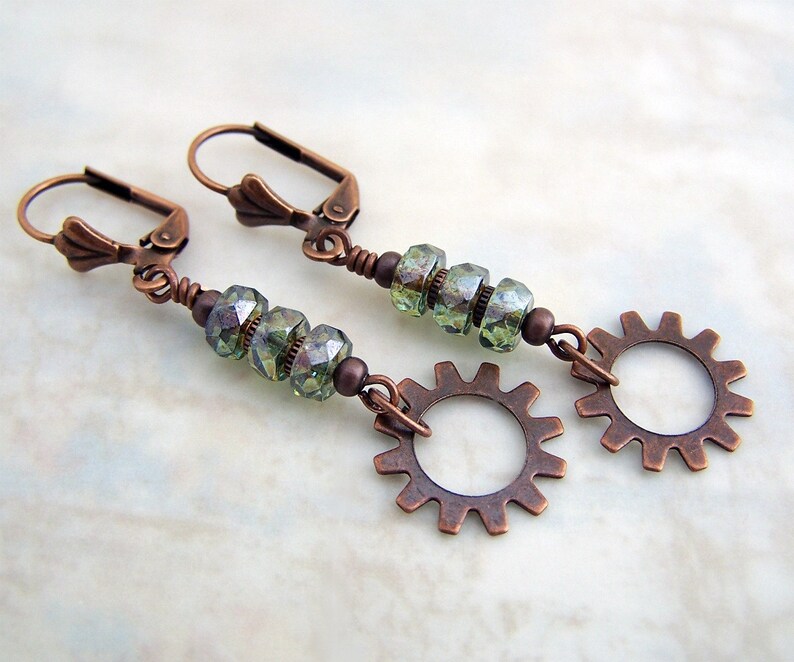 May include: Copper earrings with green glass beads and copper gear charms.