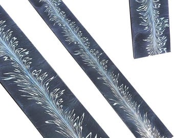 May include: Three rectangular strips of dark charcoal gray material featuring a central, elongated, feather-like pattern in white and pale blue. The design runs vertically along the length of each strip, creating a symmetrical, marbled effect.