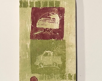 May include: Rectangular art piece with a light green background and a grid pattern at the top. It features a maroon square with a camper illustration and a green square with a car illustration. A maroon circle is at the bottom.