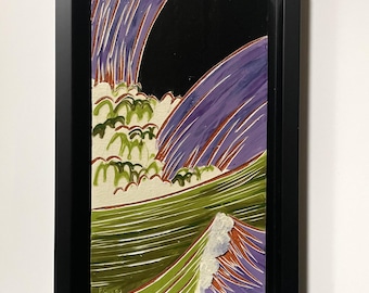 May include: A rectangular ceramic tile wall art piece framed in black, featuring a stylized wave design with deep purple, olive green, and cream colors against a solid black background, with the artist's initials P.G. visible in the bottom corner.