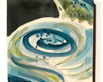 May include: A square ceramic tile featuring a crackled glaze finish. The design displays a central swirling pattern in shades of deep blue, light blue, and pale green, contrasted by a solid black section in the upper left corner.
