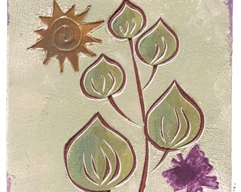 May include: Square ceramic tile with a hand-painted design featuring a stylized sun, leaves, and a small tree. The sun is brown, the leaves are green, and the tree is purple. The background is a light green with a purple border.
