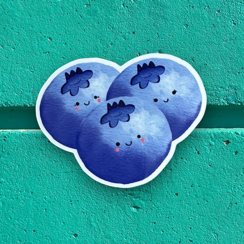 May include: Three blue blueberries with white outlines and happy faces. The blueberries are clustered together and have a watercolour-like appearance.