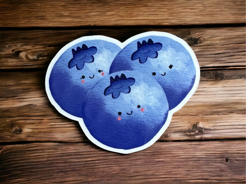 May include: Three blue blueberries with white outlines and happy faces. Each blueberry has a small, five-pointed star on top.