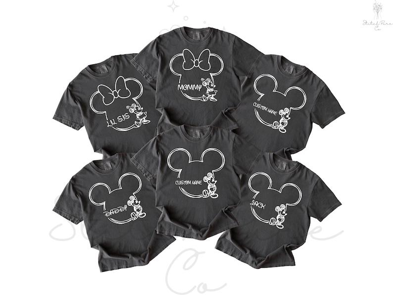 May include: A collection of dark gray t-shirts featuring white Mickey Mouse designs. Some shirts have text like "Mommy", "Lil Sis", "Daddy", "Back", and "Custom Name". The shirts are likely for a family or group.