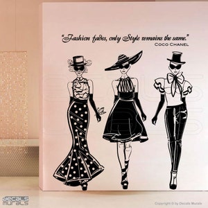May include: Black and white silhouette wall decal of three women in stylish outfits and hats. The quote "Fashion fades, only Style remains the same." by Coco Chanel is included in the design.