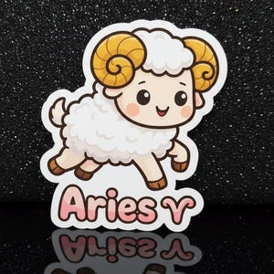 May include: Aries sticker depicting a cartoon ram with a fluffy white body, tan hooves, and golden horns. The sticker has pink and white text that reads "Aries". The background is a black glitter surface.