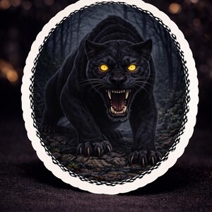 May include: Digital illustration of a black panther with glowing yellow eyes and bared teeth, set against a dark forest backdrop. The panther is in a predatory stance, framed by a decorative white border.