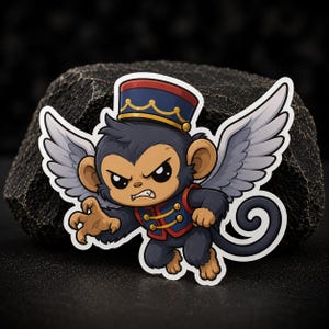 Puede incluir: Una pegatina que muestra un mono volador de dibujos animados con pelaje gris, alas grandes y cara bronceada. El mono lleva una chaqueta de estilo militar azul y roja con botones dorados y una gorra azul a juego con un borde dorado.