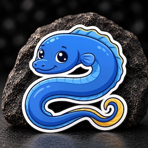 May include: A die-cut sticker featuring a cartoon blue eel with large black eyes, a smiling mouth, and a yellow fin along its back and tail. The eel has a smooth, rounded body shape and is outlined in white, creating a clean and distinct graphic design.