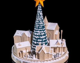 Pueblo navideño nevado: escultura detallada de una escena de pueblo invernal / acogedora cabaña cubierta de nieve