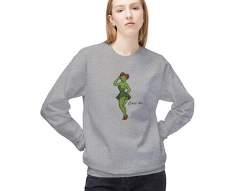 May include: A light gray sweatshirt featuring a green cartoon woman with red hair and the text "Cart Ass". The woman is wearing a green dress and red heels. The sweatshirt is a casual style.