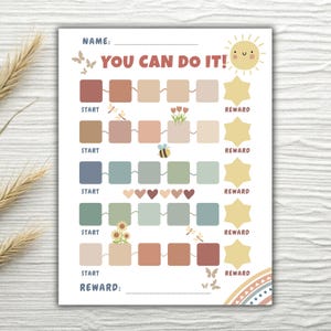 Może przedstawiać: Wydrukowany wykres nagród z napisem "YOU CAN DO IT!". Wykres zawiera kolorowe kwadraty, ilustracje kwiatów, pszczół i serc oraz uśmiechnięte słońce. Służy do śledzenia postępów i nagród.
