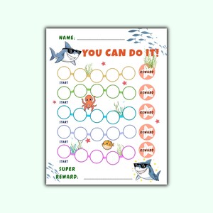 May include: A white reward chart with a cartoon shark wearing sunglasses and the text "YOU CAN DO IT!". The chart features circles for tracking progress, starfish, and sea creatures. The word "REWARD" is printed on coral-colored circles.