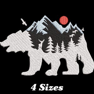 May include: White silhouette of a bear with a mountain range, trees, and a red sun inside the bear's body. The design is on a black background. "4 Sizes" is written below the bear.