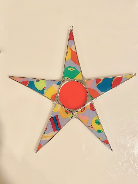 Rachel star- 10 inch lacquered fabric under glass with orange art glass center