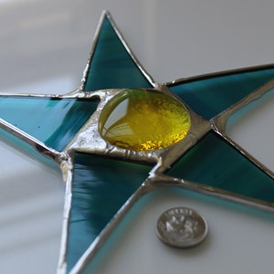 Terri 7 inch stained glass star with teal points and lemon yellow center image 3