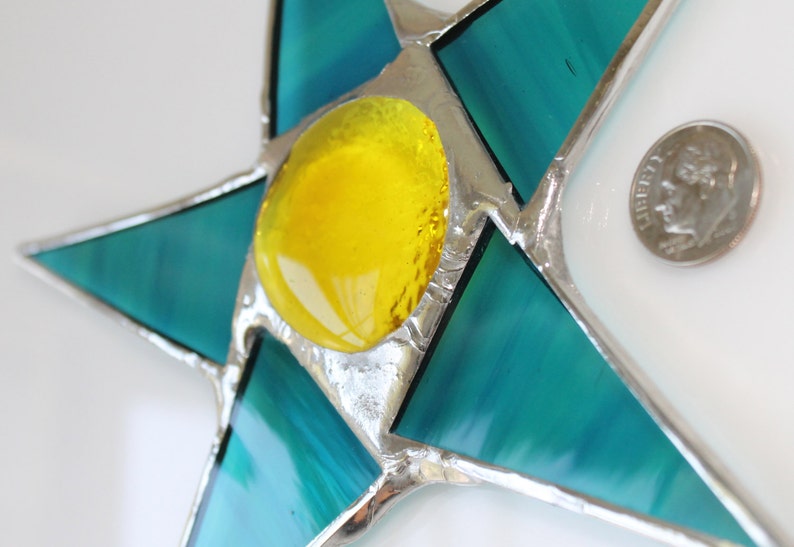 Terri 7 inch stained glass star with teal points and lemon yellow center image 1