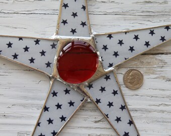 Stars and Stars- lacquered fabric on glass with red glass cabochon center