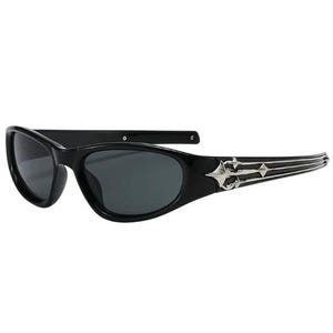 May include: Black sunglasses with a silver, ornate design on the arms. The sunglasses have a narrow, oval shape.