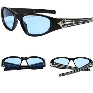 May include: Black sunglasses with blue lenses and a silver star design on the arms.