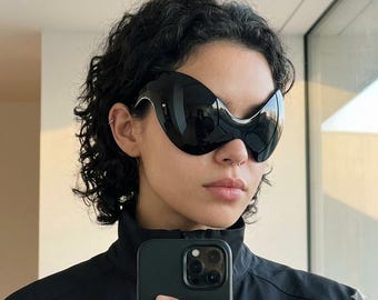 Futuristische vizierzonnebril, wikkelzonnebril, schildzonnebril