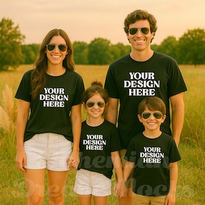 May include: A family of four wearing black t-shirts with the text "Your Design Here" printed on them. The shirts are a mockup for a custom design.