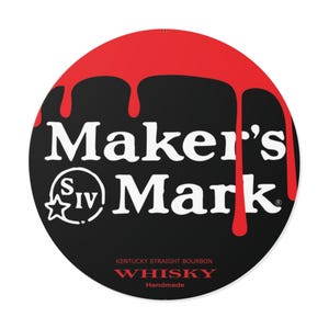 May include: Round black sign with the words "Maker's Mark" in white, with red dripping paint across the top. The sign also includes the text "Kentucky Straight Bourbon Whisky Handmade".