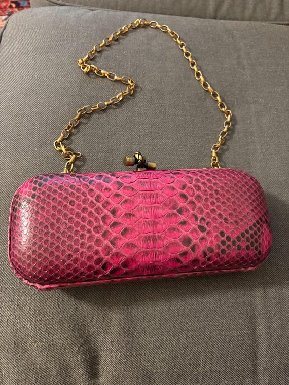 fuchsia-colored python-embossed  clutch with a go… - image 1