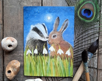 Imbolc Morning Greetings Card by Hannah Willow A Badger and Hare with Snowdrops