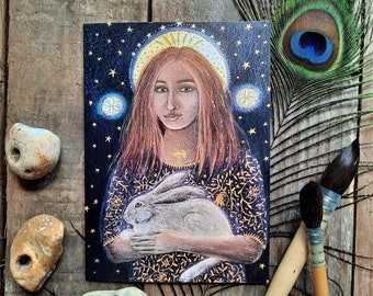 St Melangell Greetings Card by Hannah Willow a Woman holding a Hare