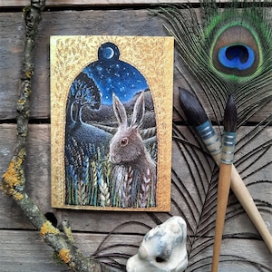 Carte de voeux Hare's Tale par Hannah Willow. Mettant en vedette un lièvre une nuit étoilée