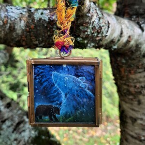 Orsi in una piccola cornice metallica bifacciale