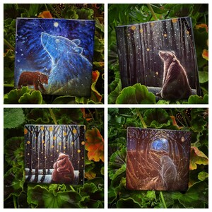 May include: Four square paintings featuring bear illustrations. One shows a bear under a starry night sky, another depicts a bear in a forest, and two others show bears in winter scenes. The paintings are surrounded by green foliage.
