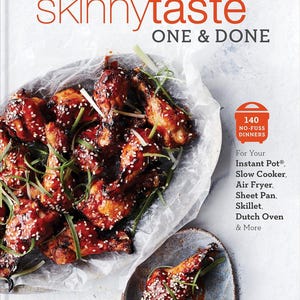 May include: A cookbook titled "SkinnyTaste One & Done" with a photo of glazed chicken wings on a white parchment paper background. The book features 140 no-fuss dinners for Instant Pot, Slow Cooker, Air Fryer, Sheet Pan, Skillet, Dutch Oven and more. The author is Gina Homolka with Heather K. Jones, R.D.
