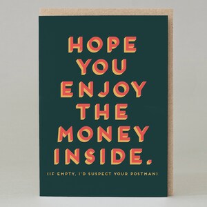 May include: Greeting card with a dark green background and the text "HOPE YOU ENJOY THE MONEY INSIDE." in red and yellow block letters. The card has a brown border and the text "(IF EMPTY, I'D SUSPECT YOUR POSTMAN!)" at the bottom.