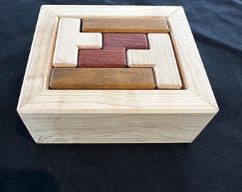 Ten piece wooden puzzle in a 2x4x5 box