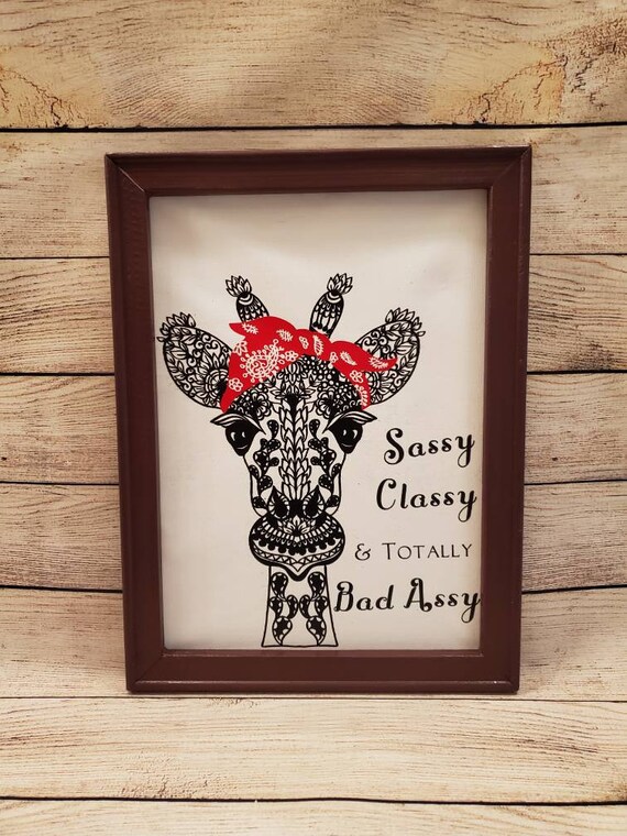 18×12 in. brown painted wood framed canvas with a giraffe mandala wearing a bandana and the phrase "Sassy Classy and Totally Bad Assy"