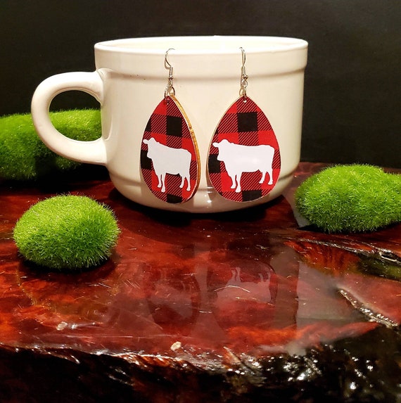 Buffalo check cow earrings teardrop shaped wood slice earrings in red and black with white cow. 2 inch