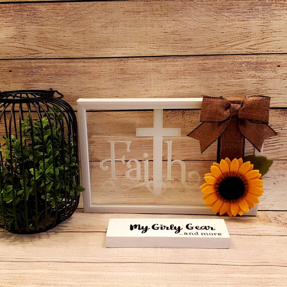 Faith sign felt sunflower white framed glass sign the word Faith with a cross as the T wrapped with ribbon and bow on one side 11×7 inch