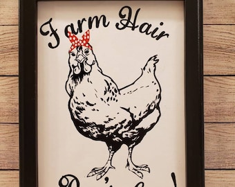 Canvas sign w/ a painted black wood frame and a large chicken  wearing a bandana and the phrase "Farm Hair don't care" in black and red HTV