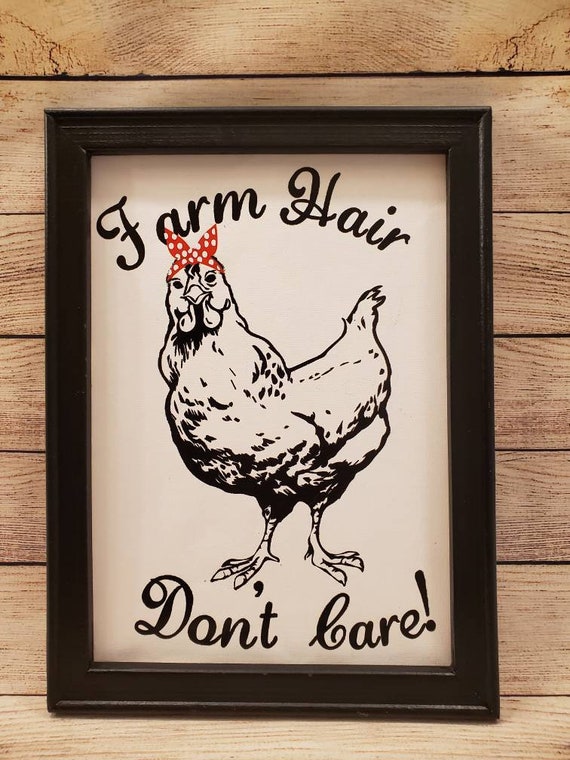 Canvas sign w/ a painted black wood frame and a large chicken  wearing a bandana and the phrase "Farm Hair don't care" in black and red HTV